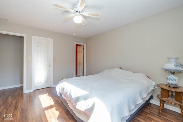 bedroom with dark wood-type flooring and ceiling fan