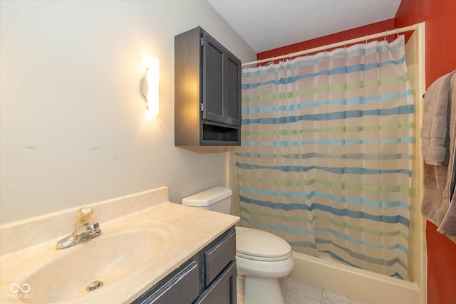 bathroom featuring toilet, tile patterned floors, walk in shower, and vanity