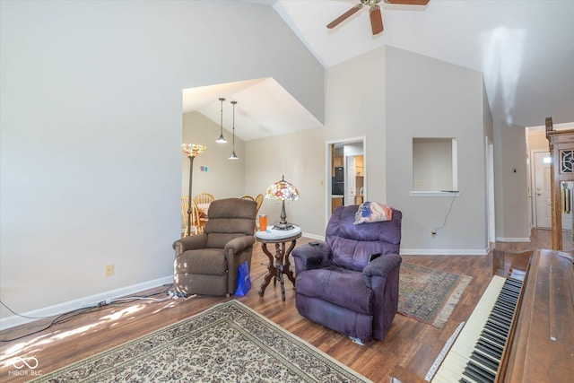 living room featuring ceiling fan, wood-type flooring, and high vaulted ceiling