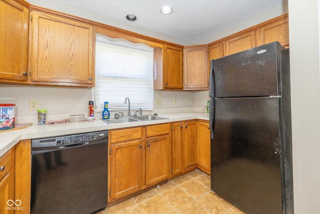 kitchen featuring sink, light tile patterned floors, and black appliances