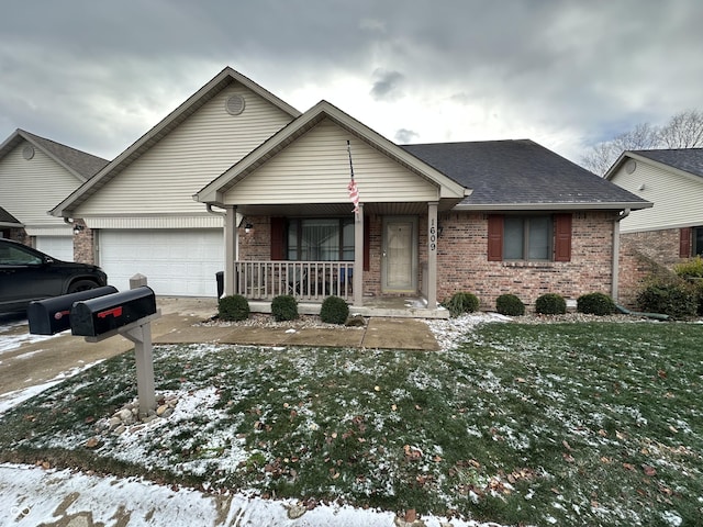 single story home featuring a yard, a porch, and a garage