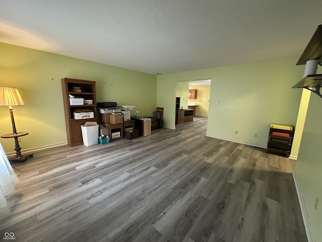 office area with wood-type flooring and a textured ceiling