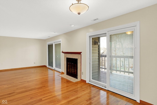 unfurnished living room with light wood-type flooring