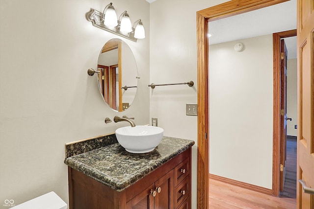 bathroom featuring vanity and wood-type flooring