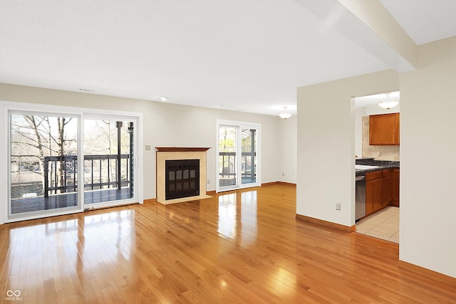 unfurnished living room featuring light hardwood / wood-style flooring