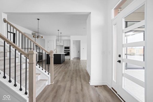 foyer entrance featuring light wood-type flooring