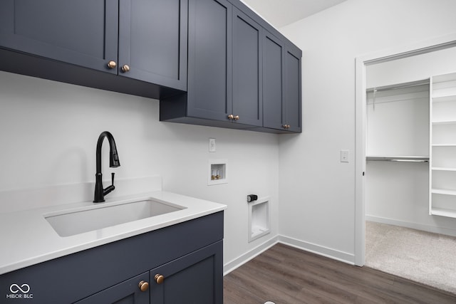 laundry room with dark hardwood / wood-style floors, cabinets, sink, and hookup for a washing machine