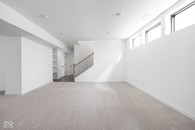 basement featuring carpet flooring