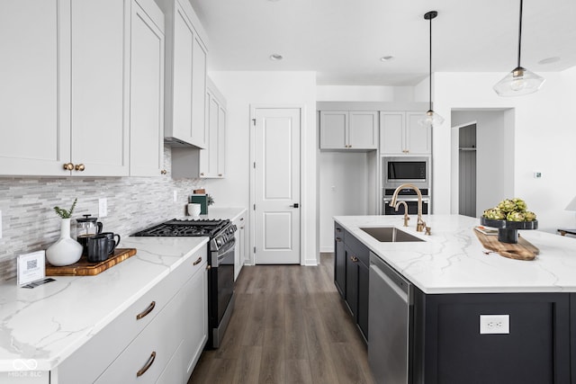 17366 Newton Main St, Westfield, IN 46074 - kitchen with stainless steel appliances, a sink, backsplash, a center island with sink, and dark wood finished floors