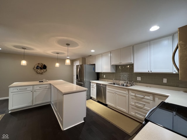 kitchen with dark hardwood / wood-style flooring, stainless steel appliances, and white cabinetry