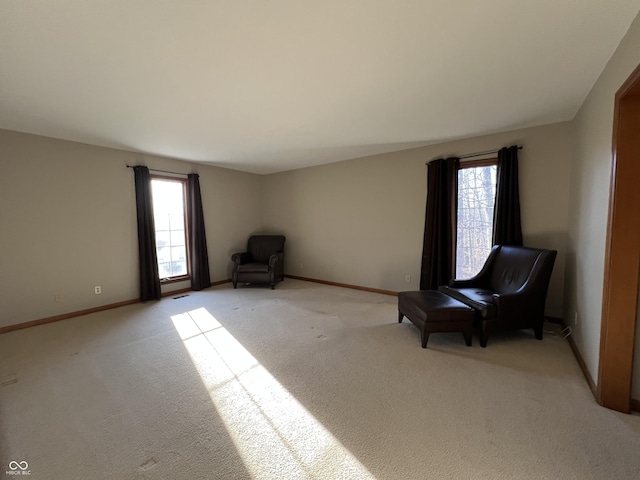 unfurnished room with light carpet and a wealth of natural light