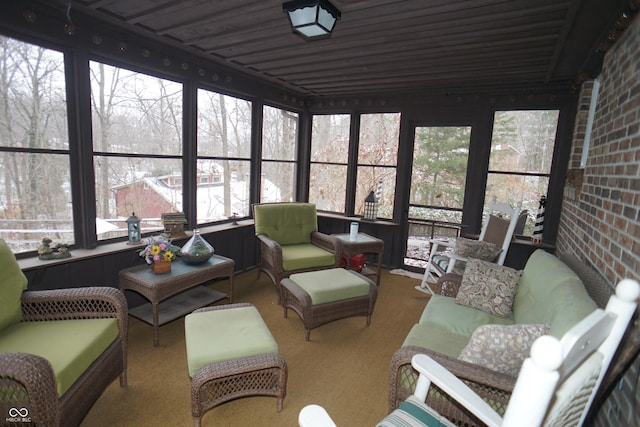 sunroom / solarium with a wealth of natural light and wood ceiling