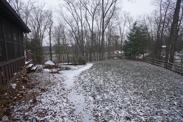 view of yard layered in snow