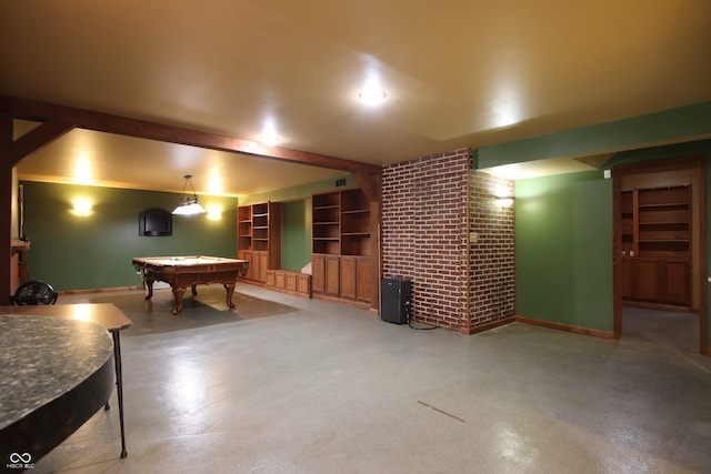 rec room with billiards, concrete floors, beamed ceiling, and brick wall