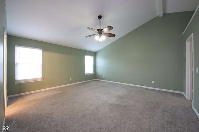 empty room with beamed ceiling, high vaulted ceiling, ceiling fan, and carpet flooring