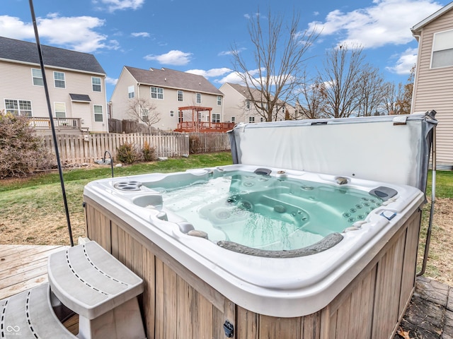 view of patio / terrace with a hot tub