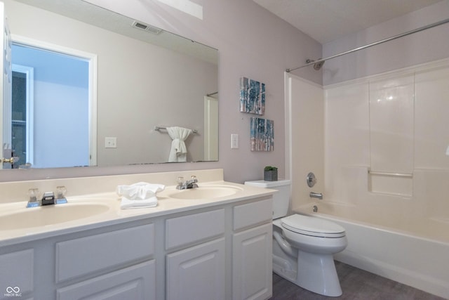 14446 Chapelwood Ln, Fishers, IN 46037 - bathroom with double vanity, toilet, visible vents, and a sink