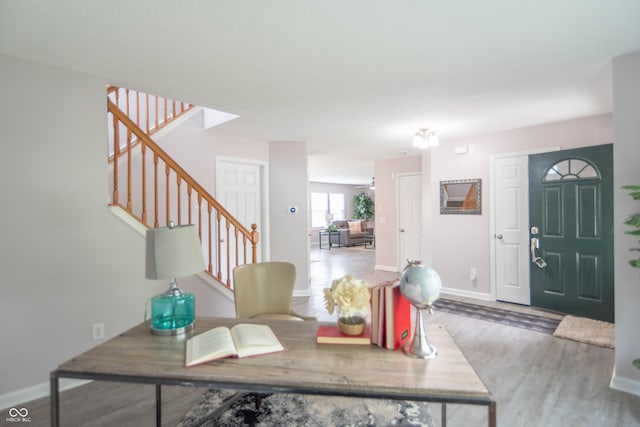 14446 Chapelwood Ln, Fishers, IN 46037 - foyer with baseboards, wood finished floors, and stairway