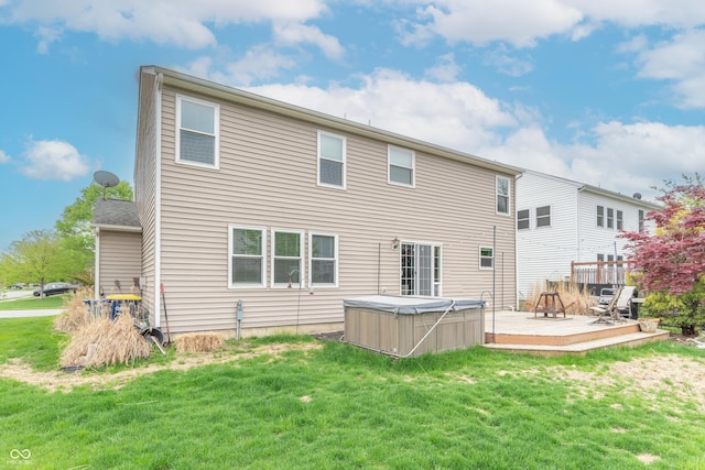 14446 Chapelwood Ln, Fishers, IN 46037 - rear view of property featuring a yard, a hot tub, and a deck