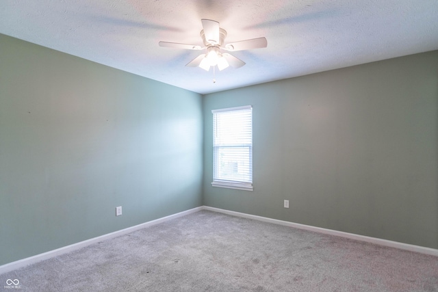 14446 Chapelwood Ln, Fishers, IN 46037 - unfurnished room with carpet floors, baseboards, a ceiling fan, and a textured ceiling