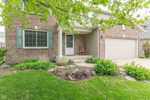 14446 Chapelwood Ln, Fishers, IN 46037 - view of front of home featuring brick siding, a front lawn, an attached garage, and concrete driveway