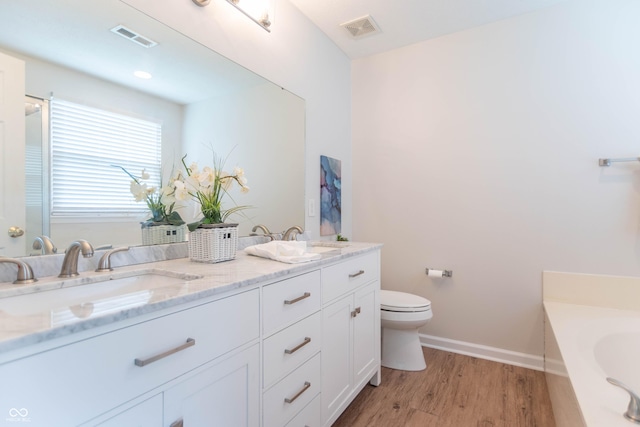 14446 Chapelwood Ln, Fishers, IN 46037 - full bath featuring toilet, visible vents, a sink, and wood finished floors