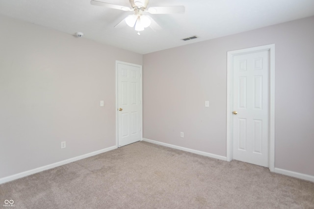 14446 Chapelwood Ln, Fishers, IN 46037 - unfurnished room featuring baseboards, a ceiling fan, visible vents, and light carpet