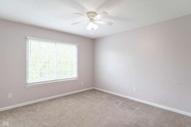 14446 Chapelwood Ln, Fishers, IN 46037 - empty room featuring light colored carpet, a ceiling fan, and baseboards