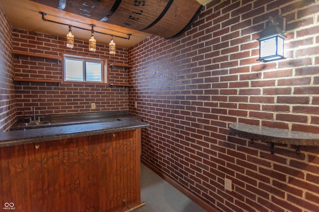 14446 Chapelwood Ln, Fishers, IN 46037 - bar featuring track lighting, bar, and brick wall