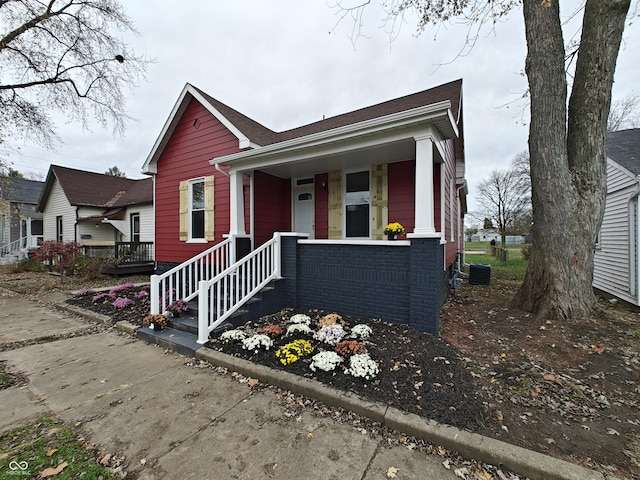 view of front facade with central AC unit and a porch