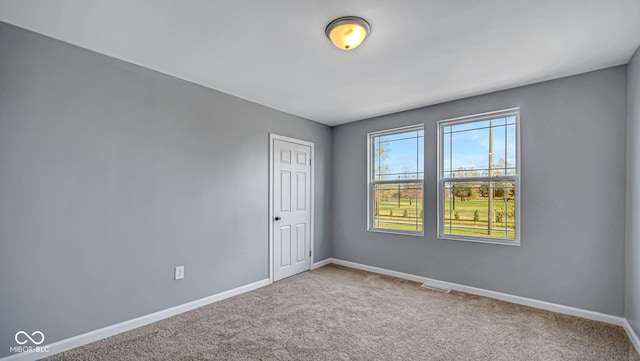 unfurnished room featuring carpet floors