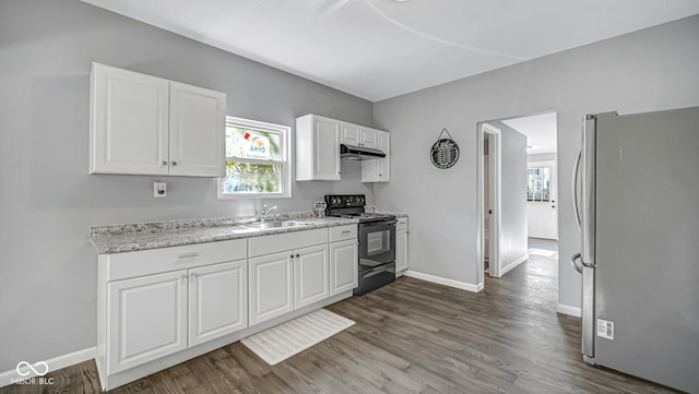 kitchen with sink, dark wood-type flooring, black range with electric cooktop, stainless steel fridge, and white cabinets