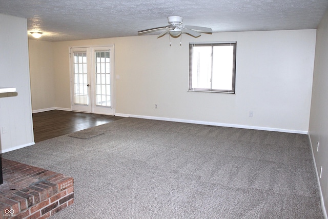 empty room with hardwood / wood-style flooring, ceiling fan, a wealth of natural light, and french doors