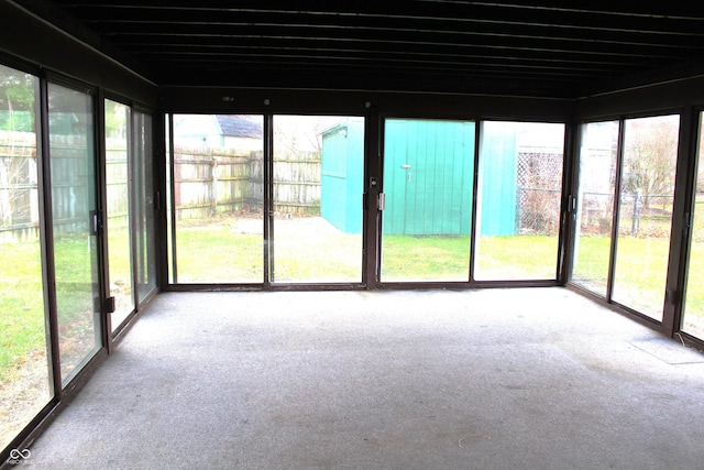 unfurnished sunroom with plenty of natural light