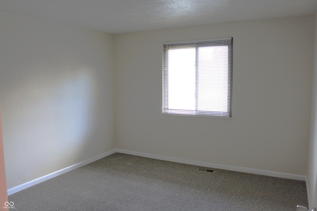 empty room with carpet flooring