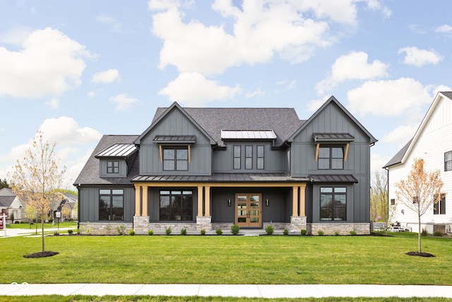 view of front of property with french doors and a front yard