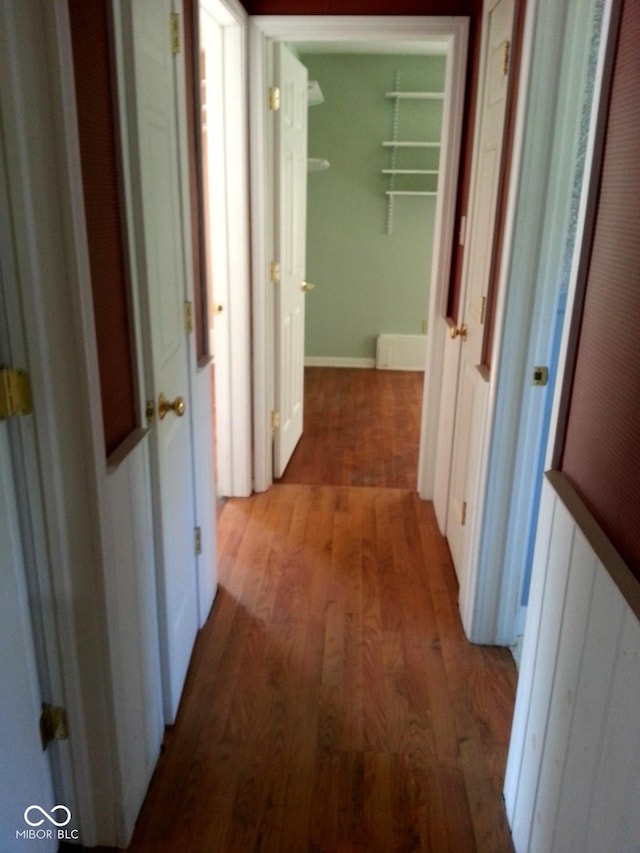 corridor featuring dark wood-type flooring