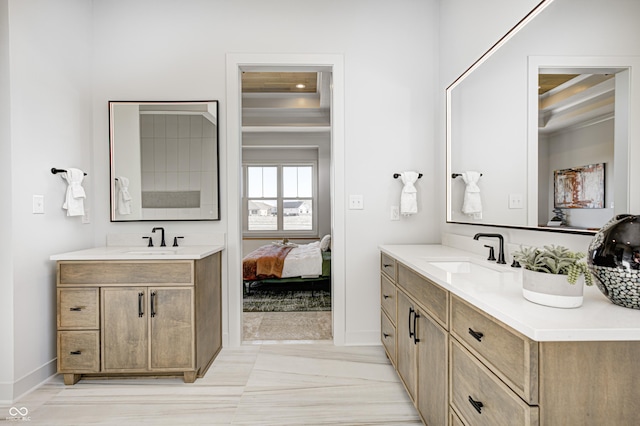 bathroom featuring tile patterned flooring and vanity