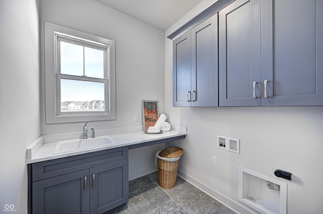 washroom featuring cabinets, sink, and hookup for a washing machine