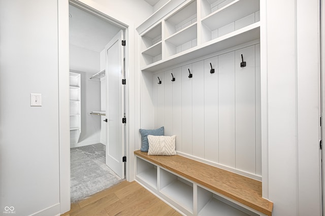 mudroom with light hardwood / wood-style floors