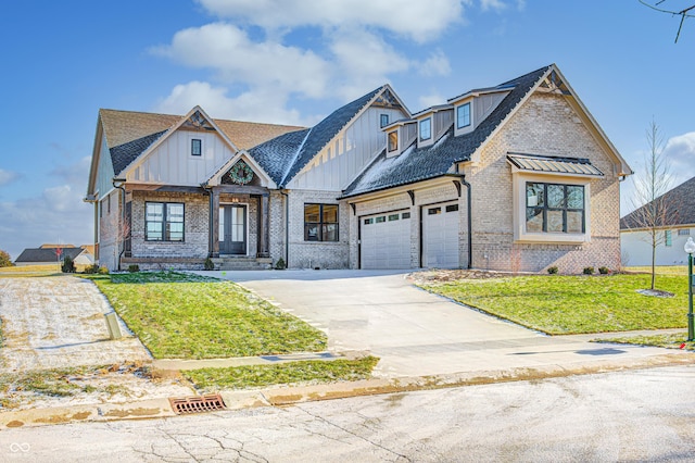 16298 Grand Cypress Dr, Noblesville, IN 46060 - view of front of home featuring brick siding, board and batten siding, a front yard, and concrete driveway