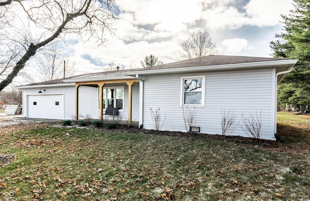 ranch-style house with a garage and a front yard