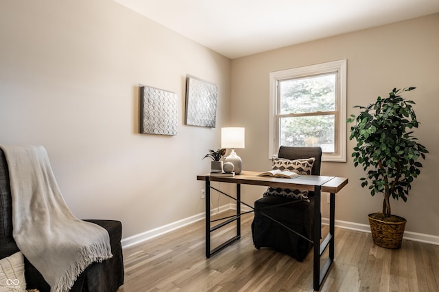 office space with light wood-type flooring