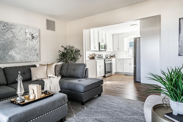 living room with dark hardwood / wood-style floors