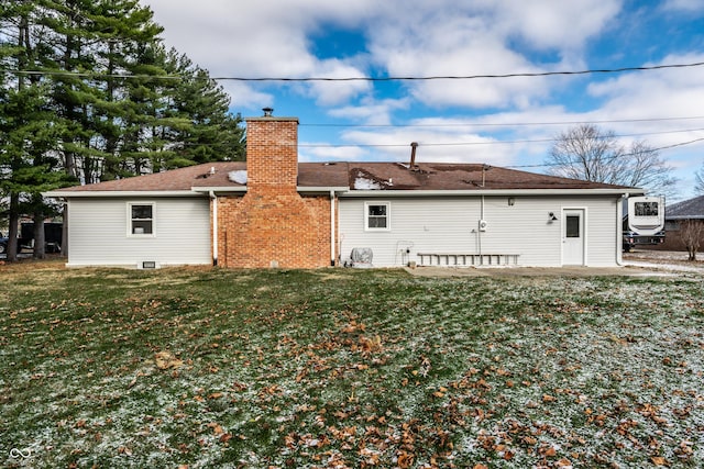 rear view of house with a lawn