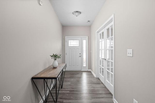 doorway with dark hardwood / wood-style flooring