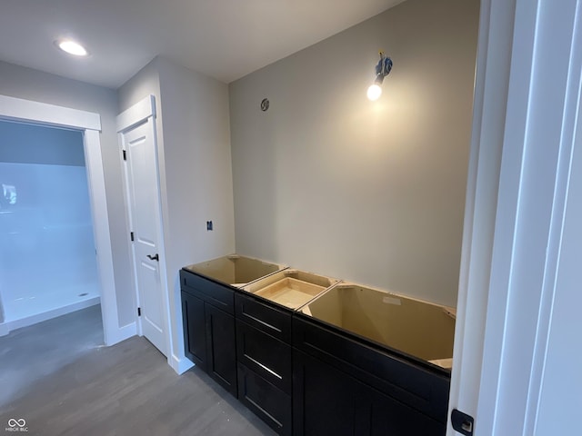 bathroom with hardwood / wood-style floors