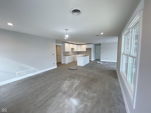 unfurnished living room with dark hardwood / wood-style floors