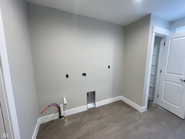 laundry area with hardwood / wood-style flooring