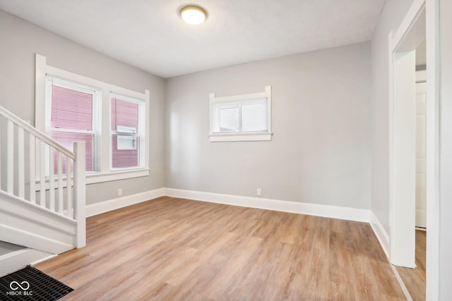 unfurnished room with light hardwood / wood-style flooring